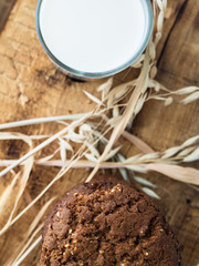 oatmeal cookies oats and milk on a wooden background