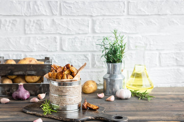 Baked young potatoes in a rustic style with sour cream