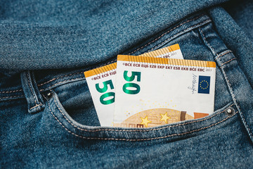 Euro banknotes in a pocket of jeans
