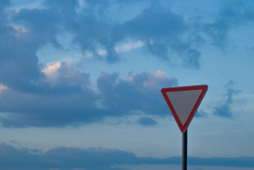 triangle road sign on sky background