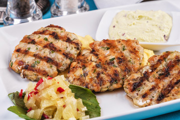  Fried fish patties served with vegetables, salad and greens and mashed potatoes according to Georgian recipe