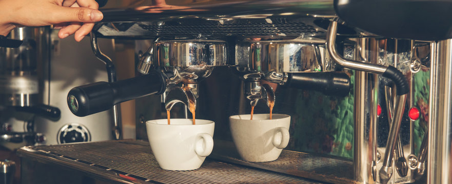 Hand make coffee shot with the espresso machine in the espresso bar