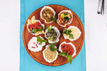  Mediterranean cuisine, European dish. set of appetizers served in mussel shells, dolma- Uzbek dish, ground beef and rice, wrapped in grape leaves, pickled mushrooms, plum sauce, tartar sauce, barbecu