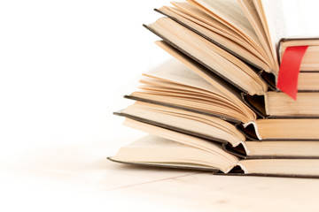Heap pile of rare books. Open book, hardback books on wooden table. Education background. Back to school. Copy space for text. Bestseller, business. Stack of books