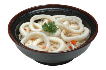 Noodles in a dark bowl on a white isolated background