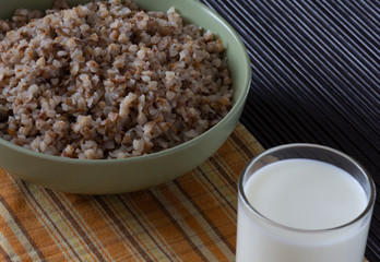 Buckwheat and glass of milk for the healthy breakfast
