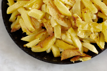 Close up fried potato on the fried pan