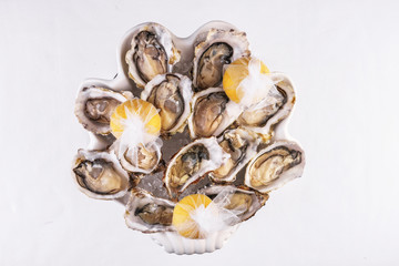 Mediterranean dish, European cuisine. Fresh raw mussels served with lemon, and assorted sauces- oyster, soy, creamy, mustard, red chili pepper sauce