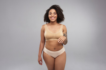 Happy Afro American woman posing for camera