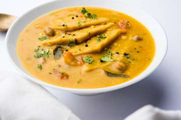 Dal Dhokli, Varan Phal or Chakolya is a gujarati, Rajasthani and maharashtrian dish made using diamond shape wheat flour cakes boiled in a dal. It's an easy one pot meal. served in a bowl.