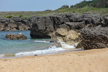 Sea Water Laps among the Stones