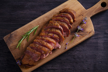Duck breast on serving board. Duck breast fillet steak