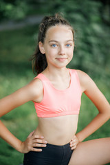 A pretty girl loves a teenager resting after an outdoor workout