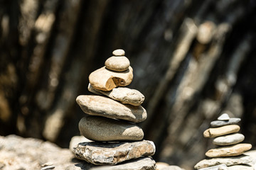 Close-up of a pile of stones in balance, Zen concept. Vernazza, Liguria, Italy