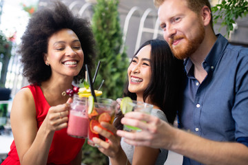 Group of friends having fun together. People talking laughing and enjoying their time