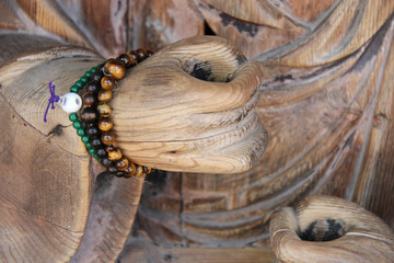wooden statue of buddha in a temple (daigan-ji) in miyajima (japan) 