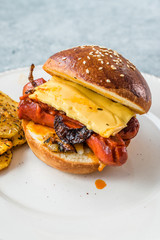 Hot Dog Sandwich Bratwurst Sausage with Baked Spicy Potatoes.