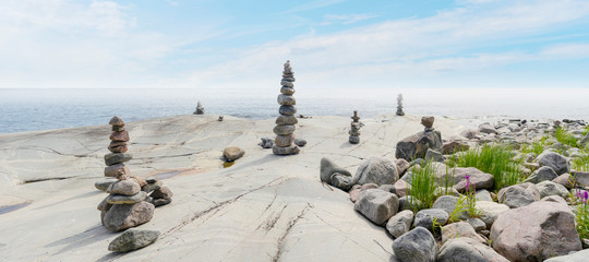 Stacked Rocks balancing, stacking with precision. Stone tower on shore. Copy space.