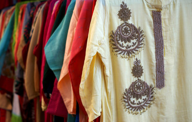 Closeup of Indian woman fashion dress salwar kameez in display of a retail shop    