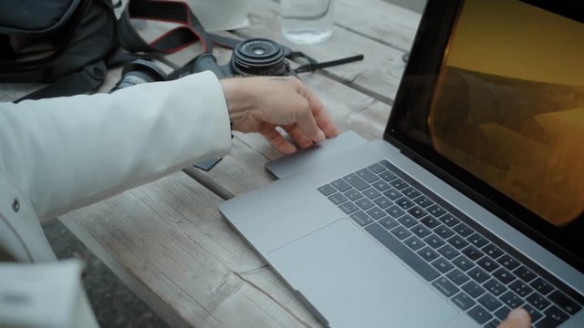 Freelance digital nomad use card adapter on laptop