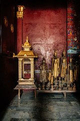 Antique old Buddha statue at Wat Xiang Thong. Luang Prabang, Laos