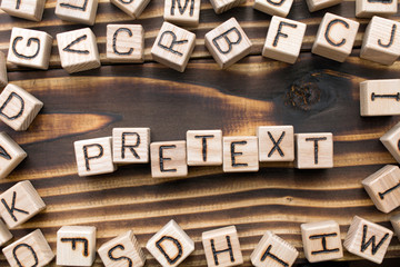 word pretext composed of wooden cubes with letters, Part of speech concept scattered around the...