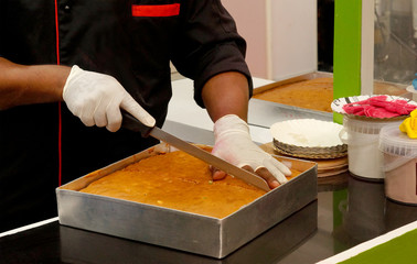 View of chef making a cake
