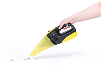 Female hand holding a portable vacuum cleaner cleaning the house, isolated on white background....