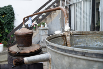 Homemade illegal distillery on the farm ready for cooking domestic brandy vodka Rakija whiskey