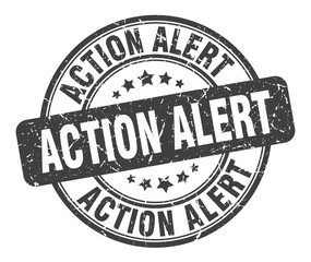 action alert stamp. action alert round grunge sign. action alert