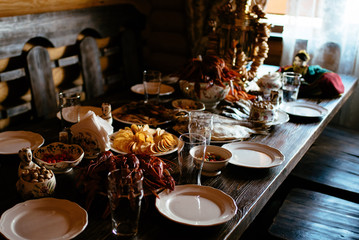 boiled crayfish, salted fish, snacks on a wooden table
