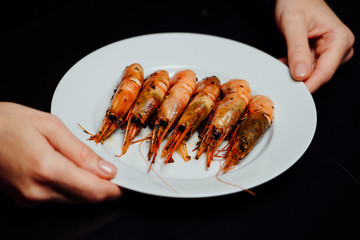 fried shrimps on a black background