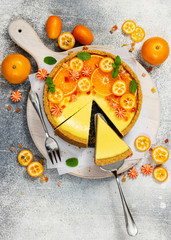 Cheesecake with slices of orange and kumquat. Top view.