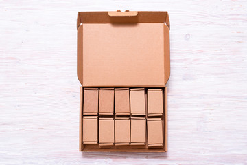 Lot of small cardboard boxes inside of large case with cover