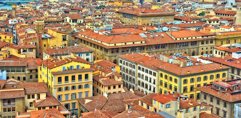 Aerial view. Nice buildings with red tile roofs in the old city. Italian culture and architecture. Panoramic skyline. Urban landscape. Italy, Florence