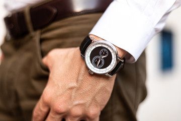 unrecognizable man with watch on wrist