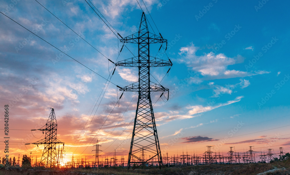 Wall mural electricity pylons at sunset