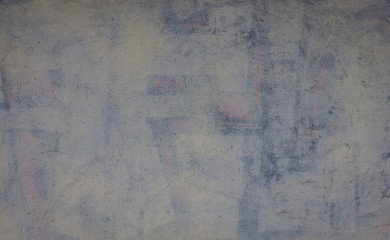 La superficie irregular de una pared, decorada con tonos azules y blancos