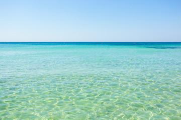 Beautiful sea with turquoise water and golden beach in Salento.