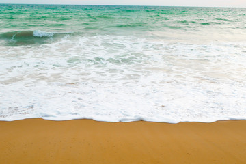 Beautiful beach ocean wave with blue color water of the sea background in daytime