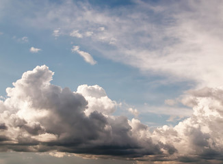 Natural looking afternoon sky with beautiful summer rain cumulus and stratus clouds with copypaste...