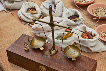 Old brass scales to weigh herbs and spices in old grocery