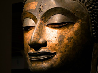 Bangkok, Thailand - Feb 23, 2019: Close up of Head of Buddha, antique bronze Buddha face, National Museum Bangkok Thailand, Public allowed to take picture.