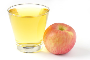 Red apple juice in glass and apple fruit isolated on white background