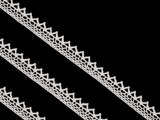White laces on black background. Lacework concept