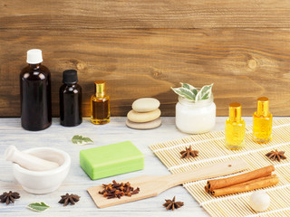 Aromatherapy and spa set on a white and brown wooden background