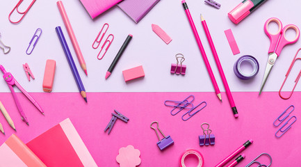 Flat lay of office, school stationery on pink background