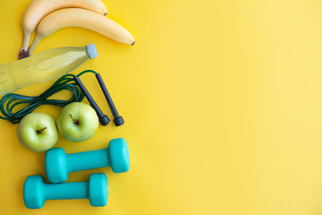 Healthy lifestyle concept on yellow background with place for text