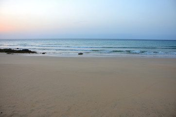 Fototapeta na wymiar Sunrise by the Sea with Low Tide in Fuerteventura, Canary Islands
