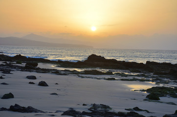 Fototapeta premium Sunrise by the Sea with Low Tide in Fuerteventura, Canary Islands